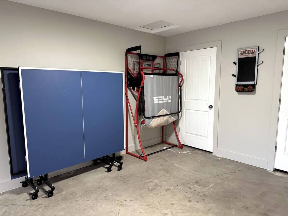 There is a Ping Pong Table, and a Basketball Arcade game in the Garage.
