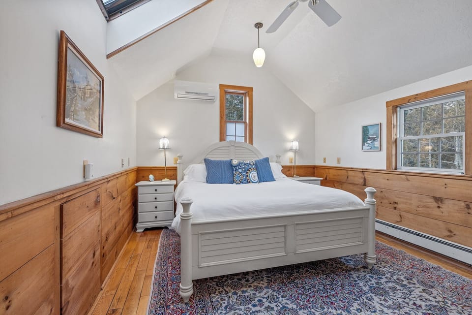 Master bedroom with mini split , king bed, and TV