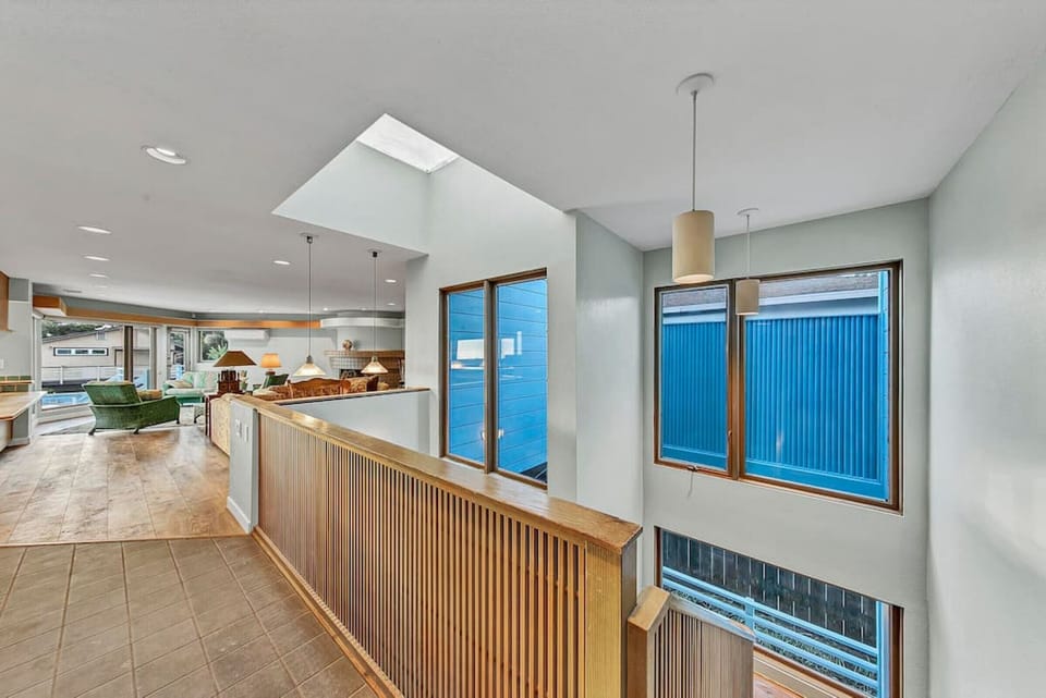 Let the sun and surf vibes in! Ocean Blue Surf Sanctuary has skylights and custom architectural features, creating a coastal home filled with natural light and unique design.