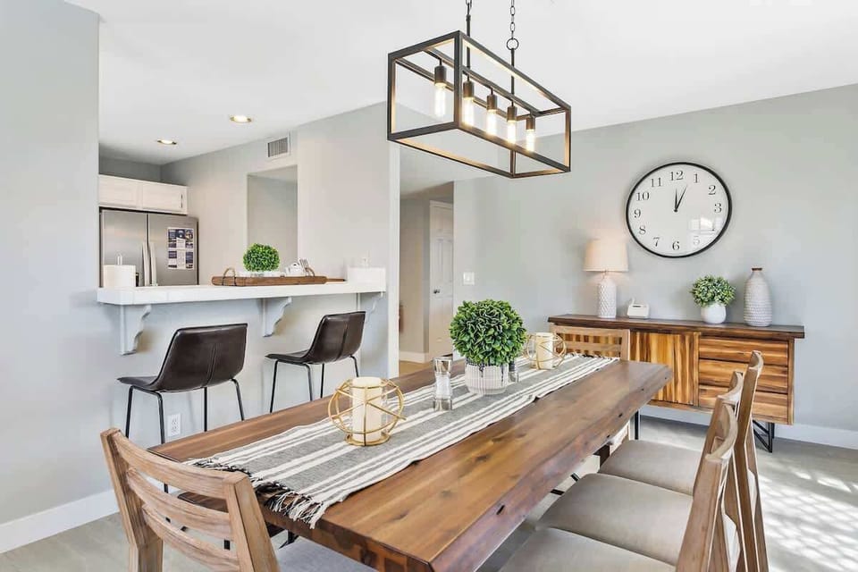 Enjoy meals together at our modern and inviting dining room table.