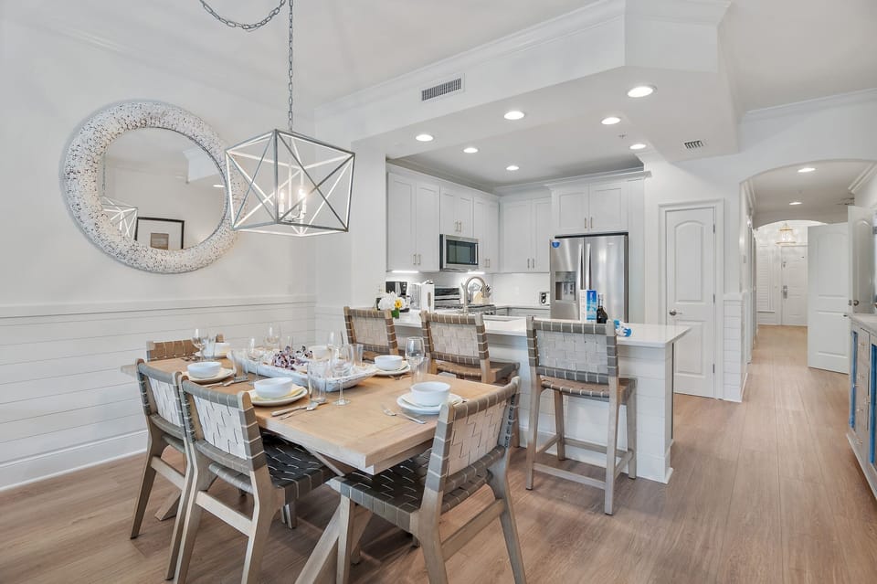Kitchen and seating area at Adagio E103 - All-new flooring makes for a FIVE star stay at Adagio E103.