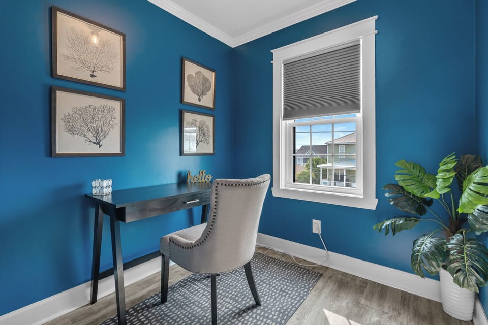 Settle into this charming nook, where botanical prints adorn the walls and natural light floods in, creating an inviting space for reflection, work, or a casual "hello" to the day ahead.