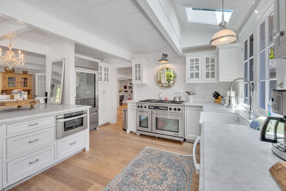 Fully equipped kitchen with bar stool seating for 6