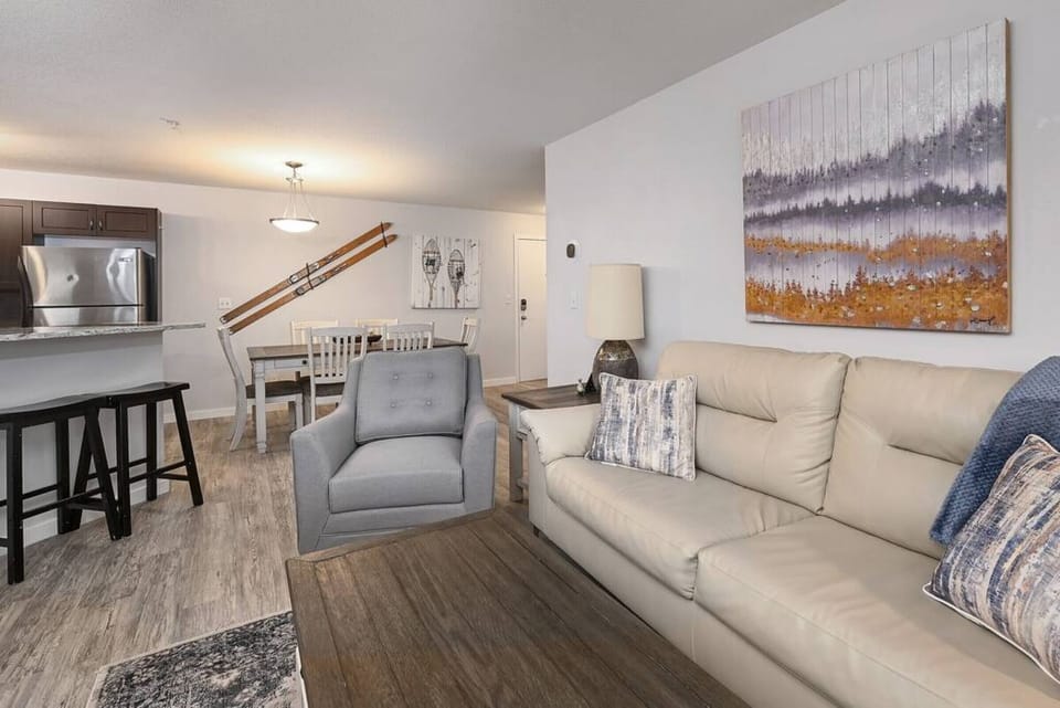 Living room with electric fireplace & smart TV & access to the oversized patio space.