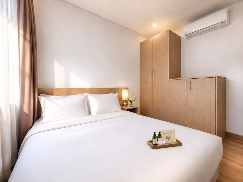 DELUXE TWO BEDROOM APARTMENT CITY VIEW | Minibar, in-room safe, desk, blackout drapes