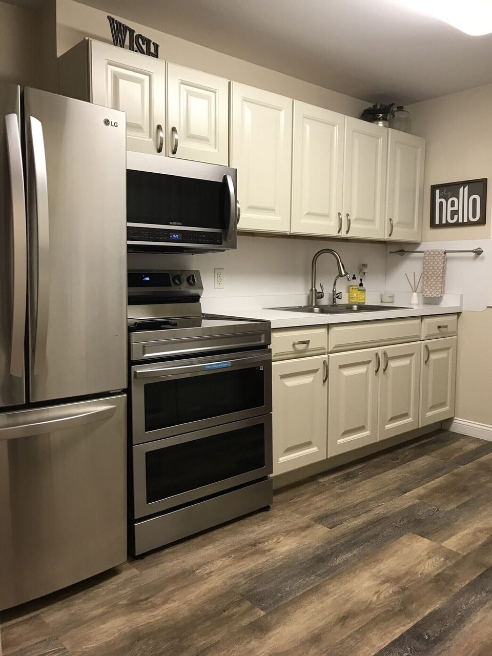 Main kitchen with new appliances including a Samsung double oven with air fryer.