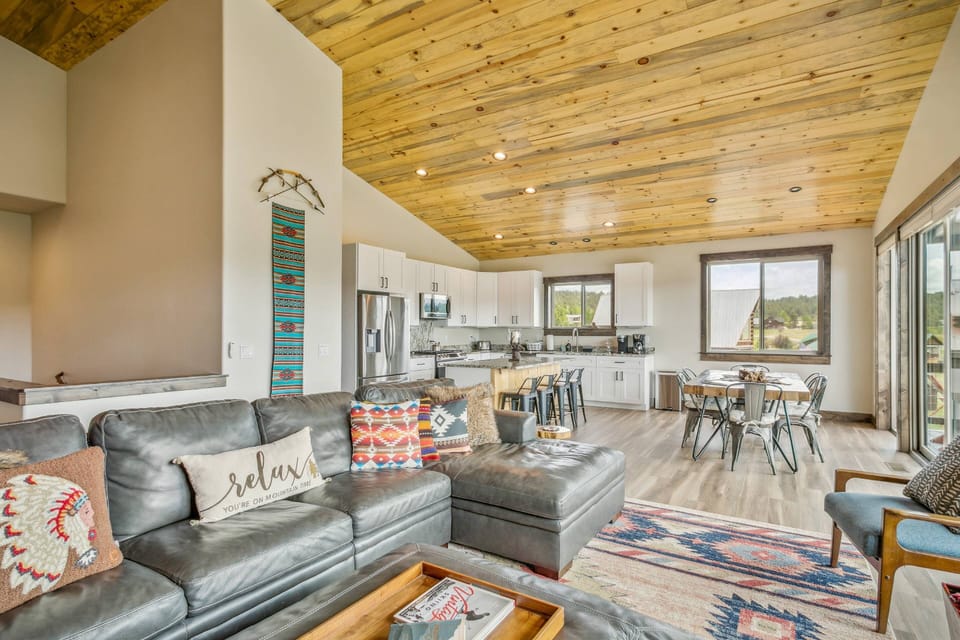 Entering the 5 bed 3 bath Basecamp you will walk right into a newly designed open concept main room with patio access and large cozy gas fireplace.