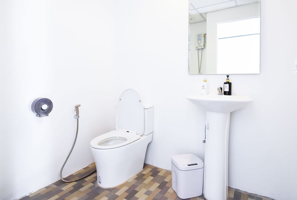 Shower, hydromassage showerhead, designer toiletries, towels