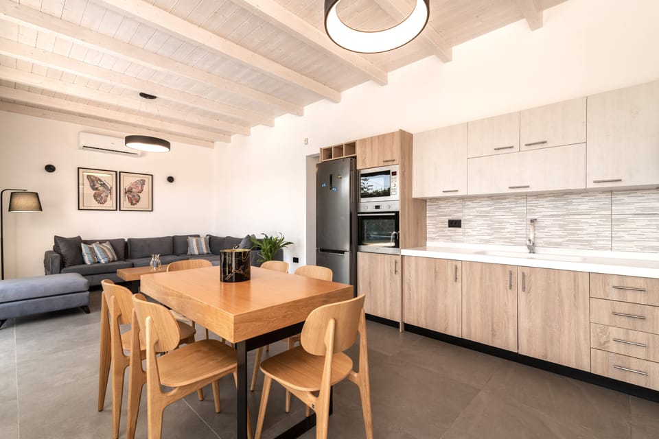 Spacious dinning settings, with a open plan fully equipped kitchen.