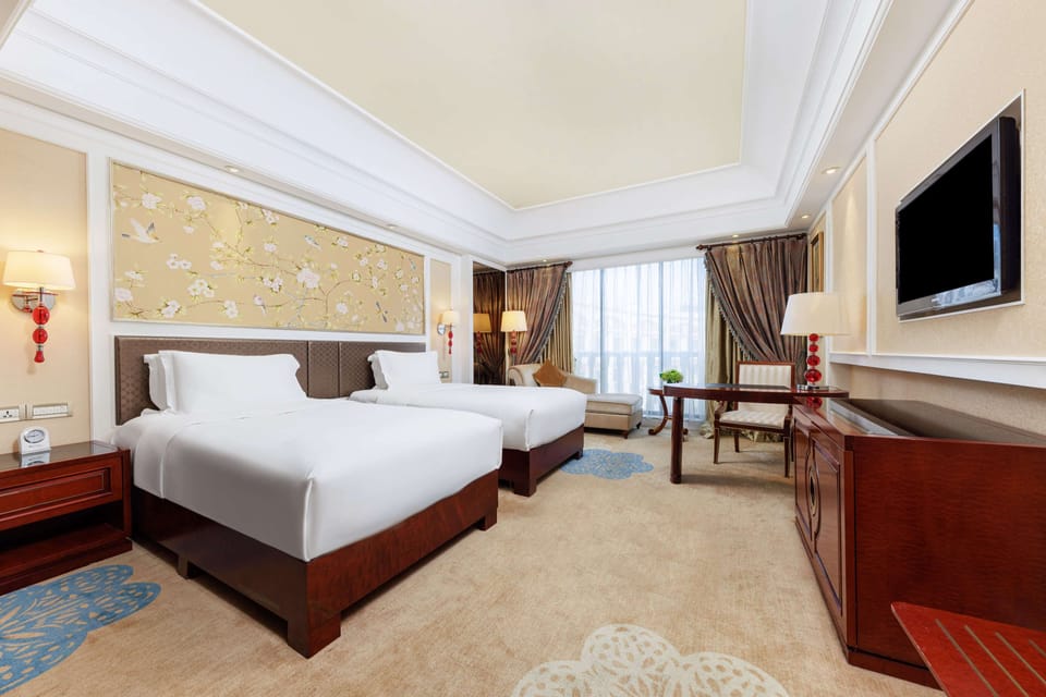 Premium bedding, down comforters, pillowtop beds, minibar