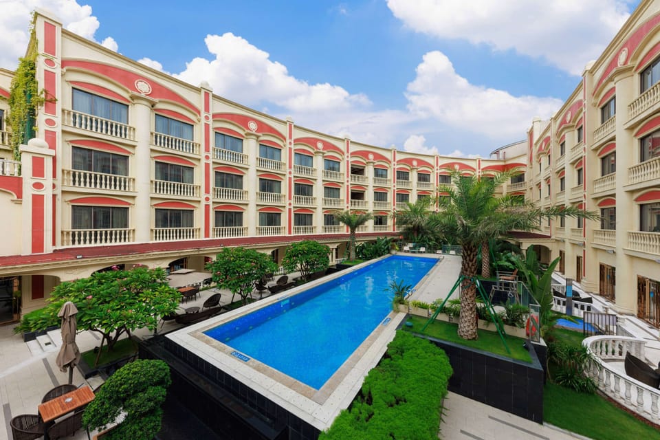 Outdoor pool, open 9:00 AM to 8:30 PM, pool umbrellas