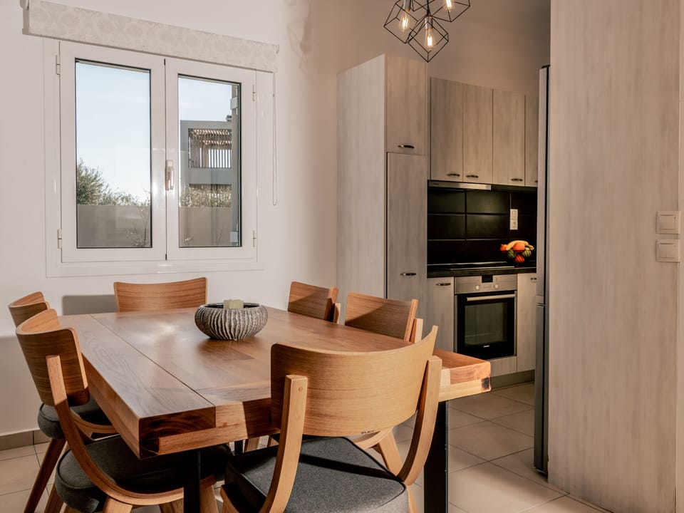 A spacious kitchen with a dinning spot lays on the ground floor.