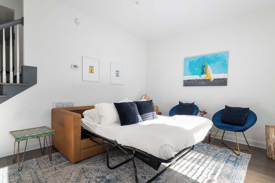 Living room space with a sleeper sofa. We are looking forward to hosting you in beautiful downtown Charleston, SC!