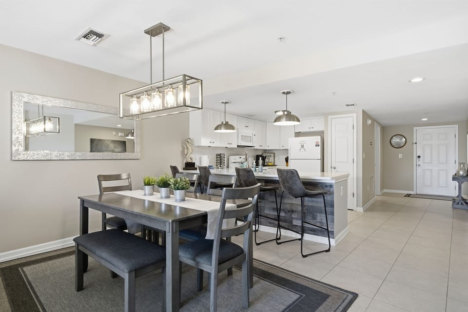 Enjoy meals together at the stylish dining table, with room for everyone and the kitchen just steps away.