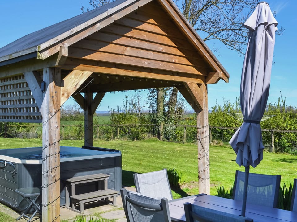 Angerton cottage, patio area with hot tub | Angerton Cottage, Carlisle