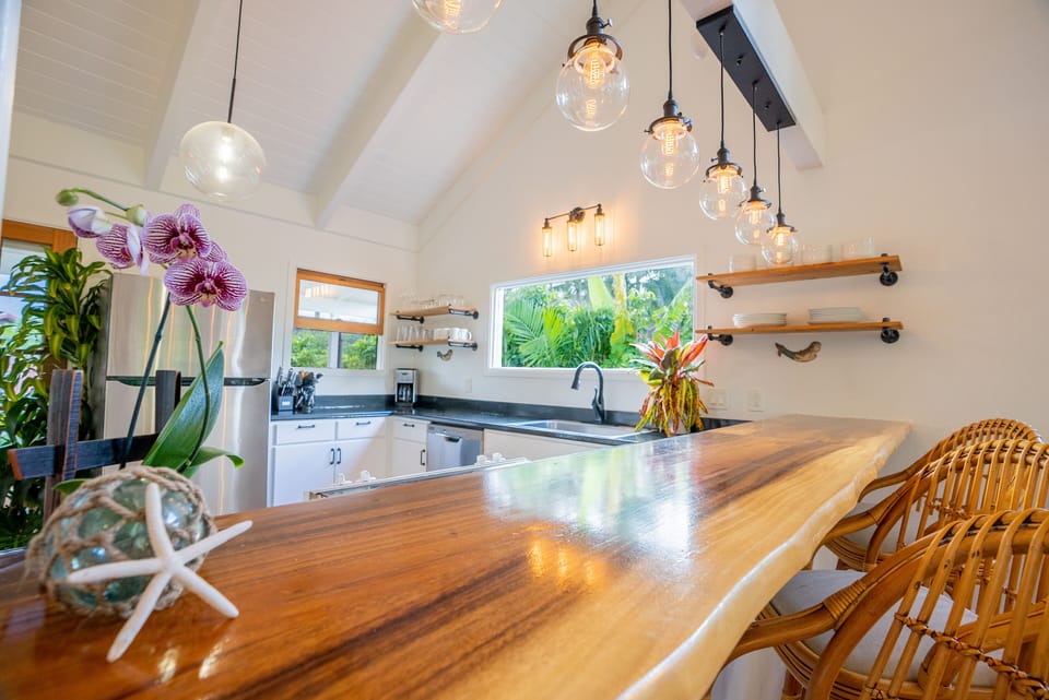 Upstairs stocked kitchen with dishwasher, oven, stove & plenty of counter space