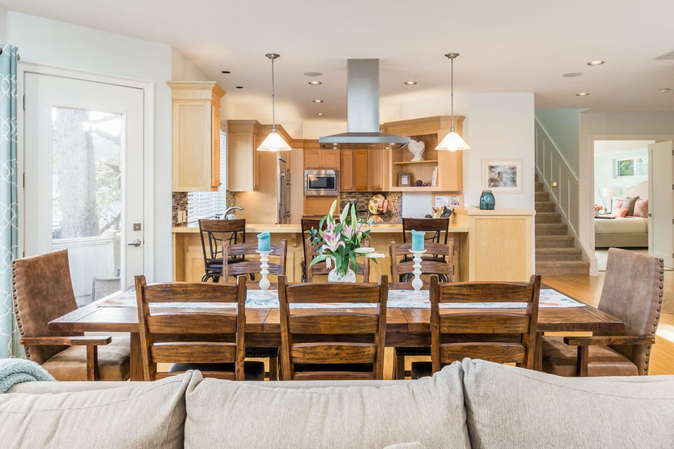 Dining table can seat 8-10 (additional chairs available).