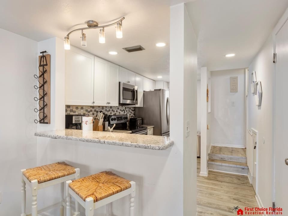 Cozy kitchen nook with modern appliances and seating