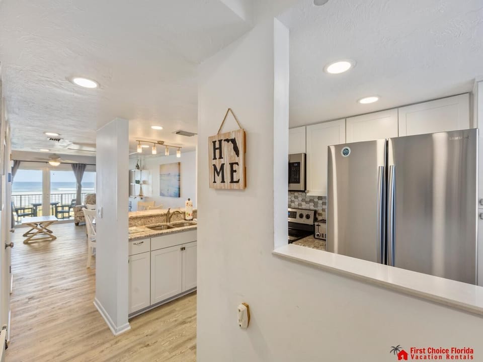 Bright, open kitchen with modern appliances and cozy dining nook