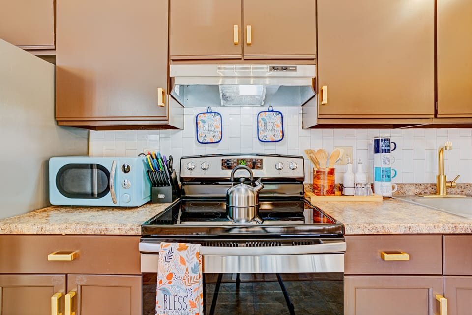Brand new appliances, microwave, toaster, tea kettle, pots, and pans