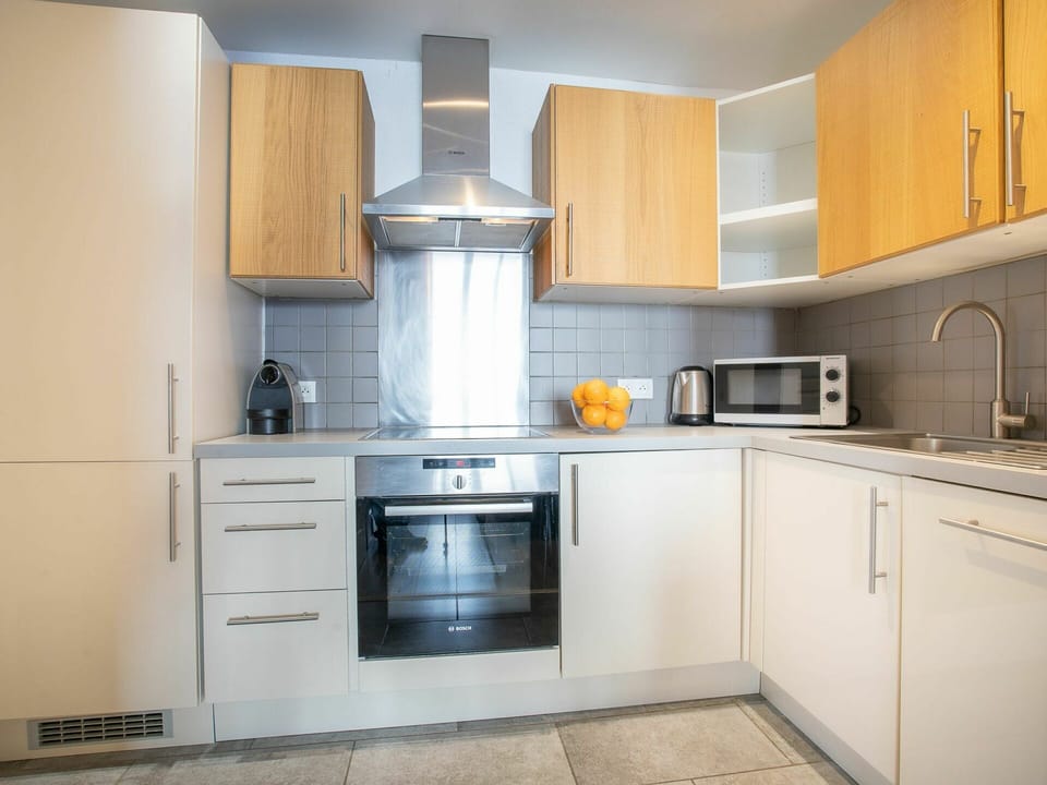 Cabinetry, Countertop, Property, Building, Kitchen Sink, Kitchen Appliance, Sink, Kitchen Stove, Kitchen, Home Appliance