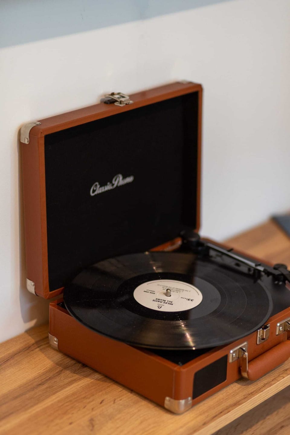 A retro-style record player adding a nostalgic touch to the living room decor.
