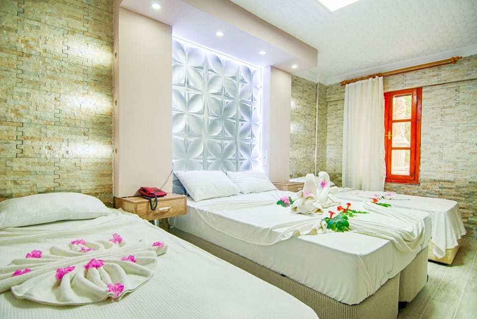 Honeymoon Triple Room | Premium bedding, minibar, WiFi (free), bed sheets