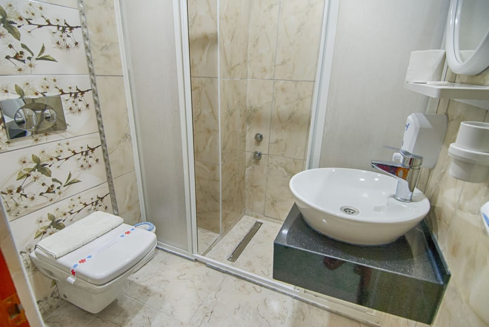 Shower, rainfall showerhead, hair dryer, towels