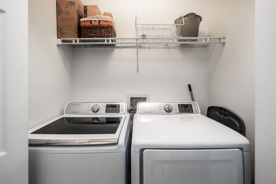 Laundry center - A full size washer & dryer is provided for all you laundry needs. You can store your washing  products on the shelves.