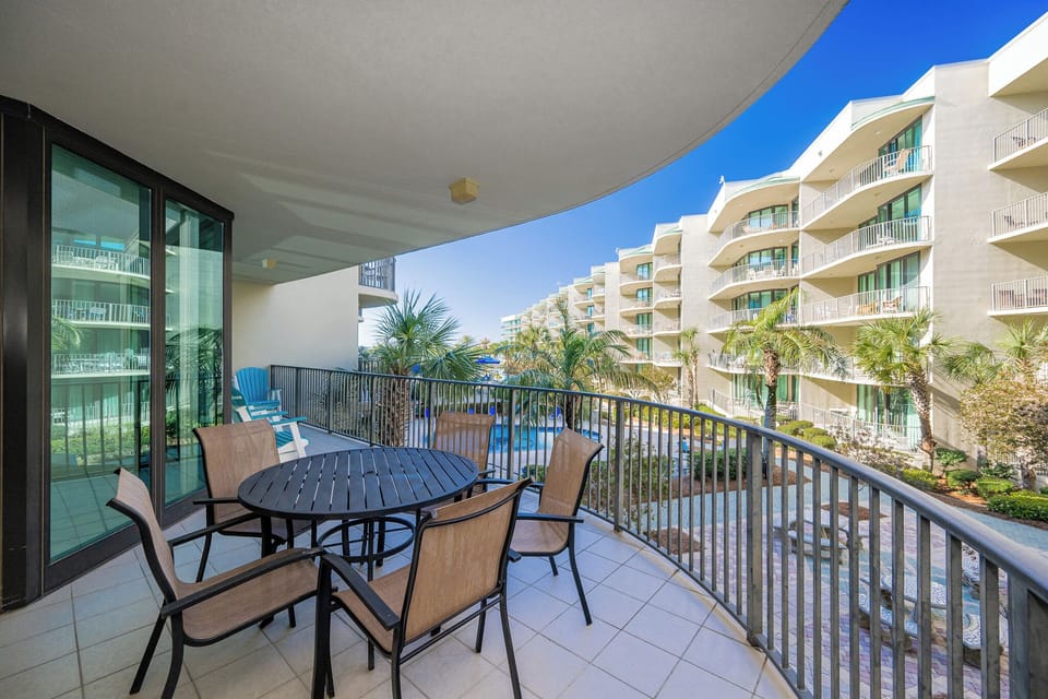 Relax on the spacious balcony, soaking in coastal breezes while surrounded by lush greenery and inviting views