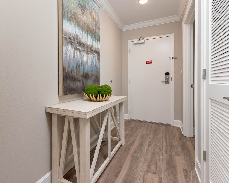 Step inside this welcoming entryway, where a stylish table and art invite you to unwind before your beach adventures