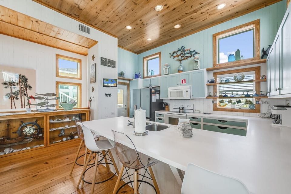 Cheerful coastal kitchen perfect for cooking and gathering.