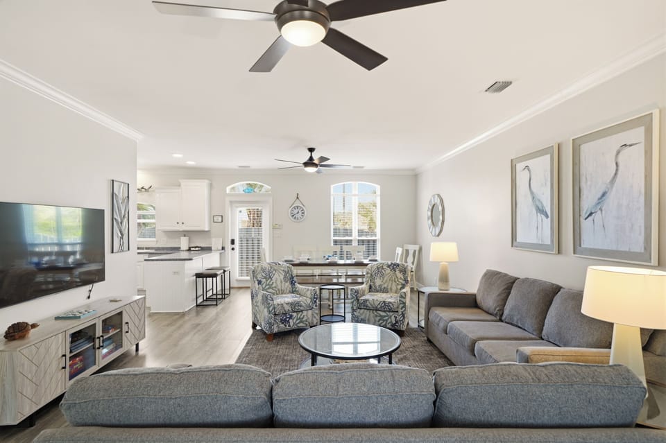The living area leads seamlessly into the dining area