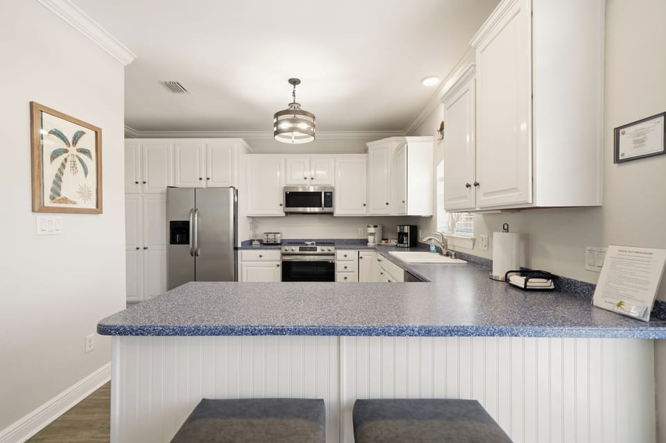 The spacious kitchen is fully-equipped with all your favorite small appliances