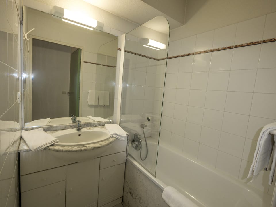 Get ready for your day in the lovely bathroom.