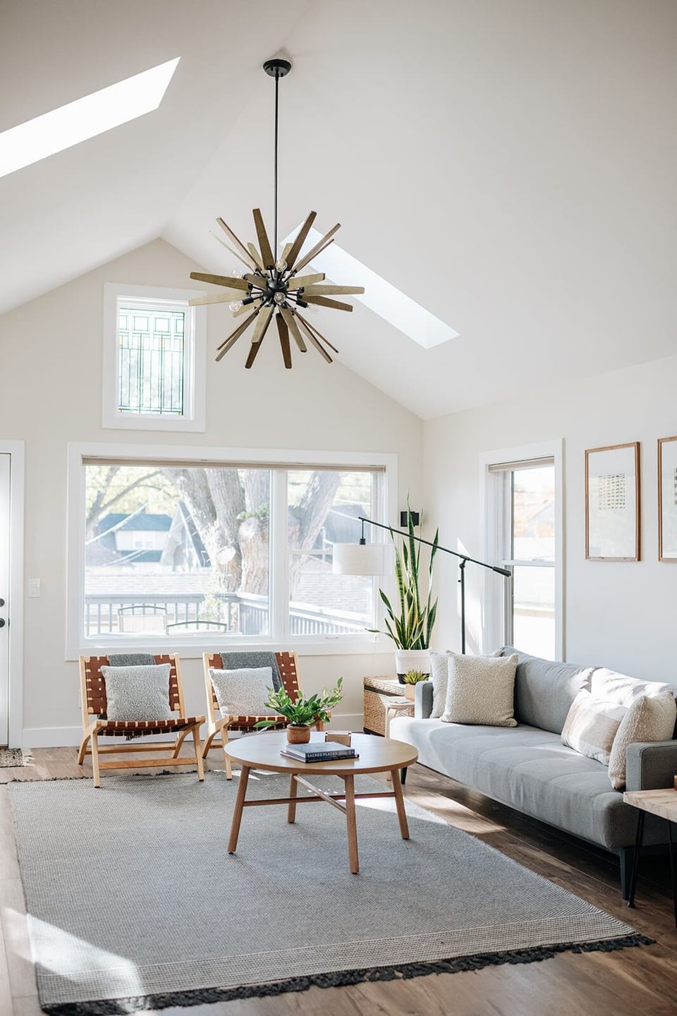 Lovely, gathering space with 4 chairs and sofa with a large Smart TV. 
