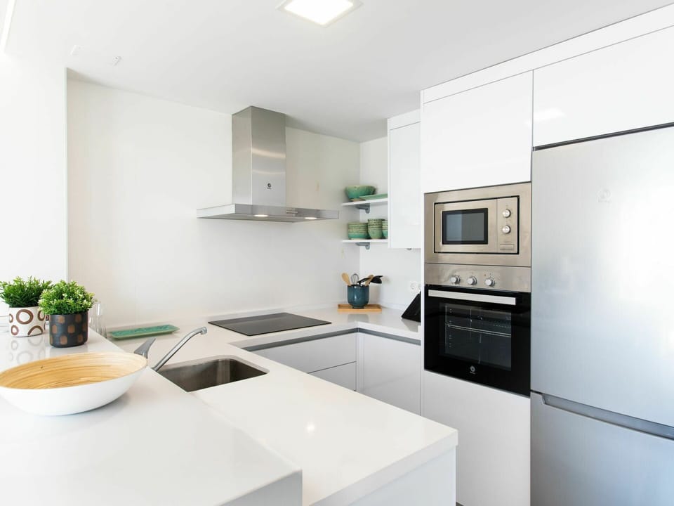 Cabinetry, Property, Furniture, Countertop, Kitchen Stove, Sink, Kitchen, Houseplant, Wood, Flooring