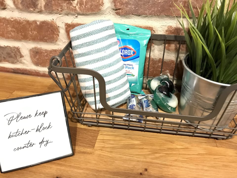Sanitizing wipes, dishwasher, and laundry pods starter basket.