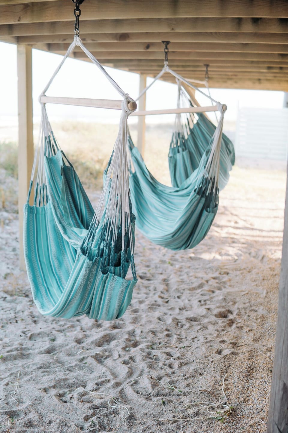 Relax in style with three outdoor hammock chairs.