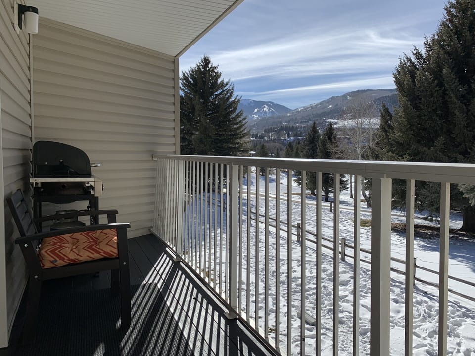 Enjoy a beverage with gas grille and views of Grouse Mountain at Beaver Creek