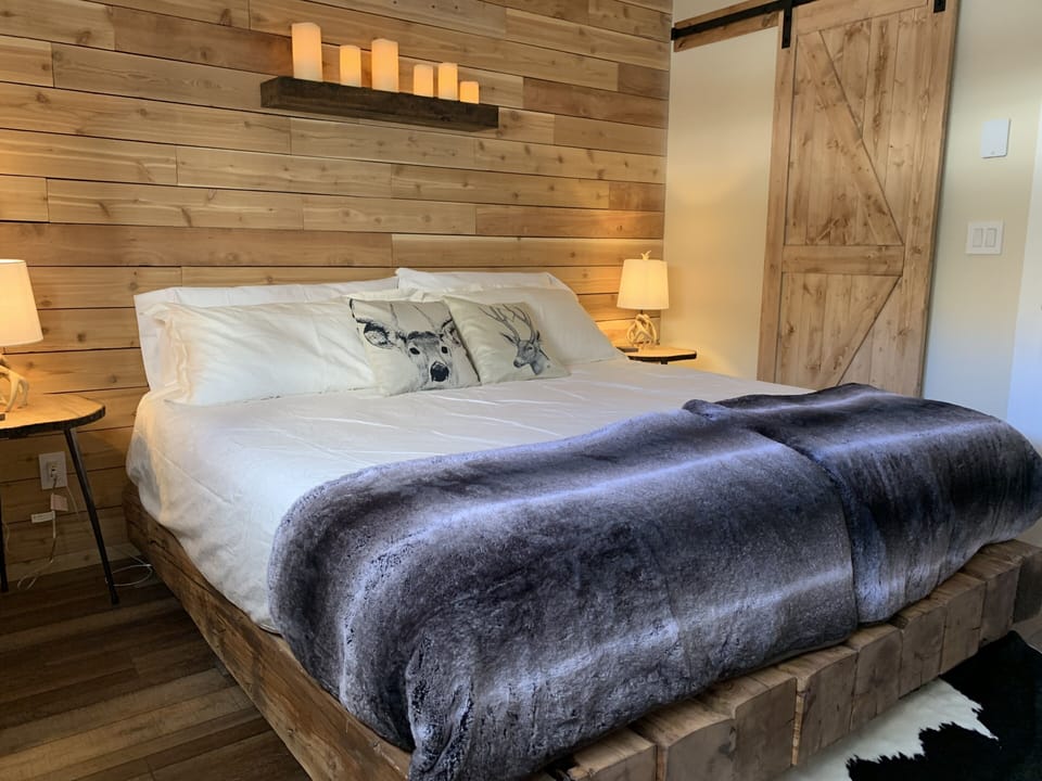King Size Master Bed, candles are operable via remote.