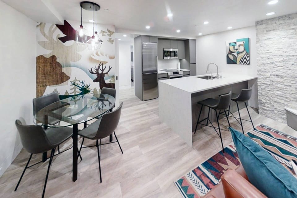The custom artwork creates a cozy atmosphere in this modern mountain apartment!