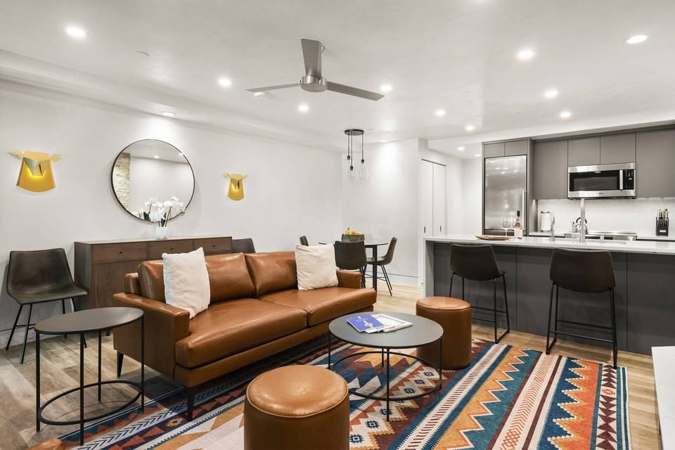 The living room offers a deep comfy sofa with an incredible sink-right-in feel.