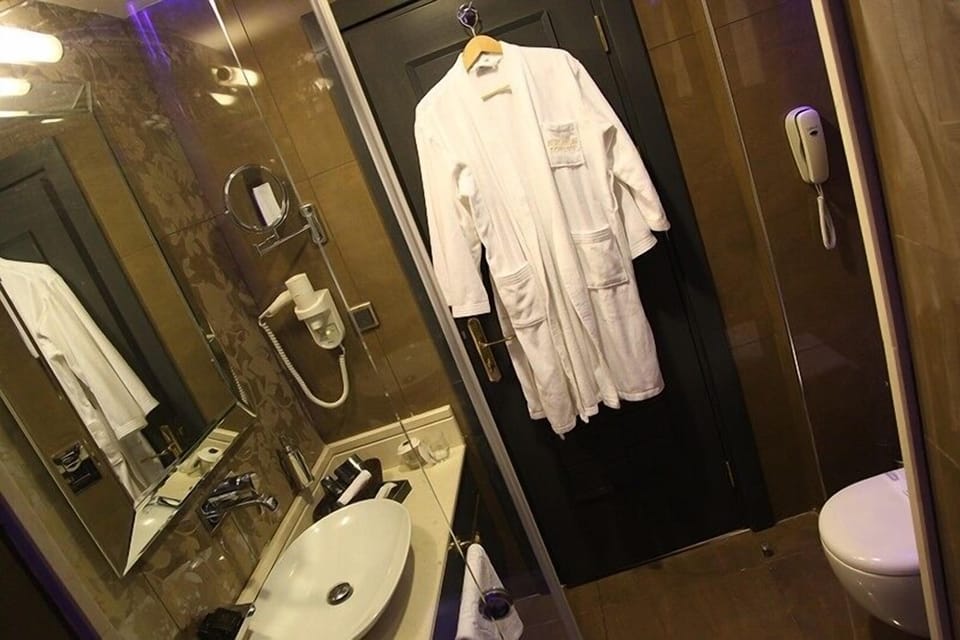 Shower, free toiletries, hair dryer, slippers
