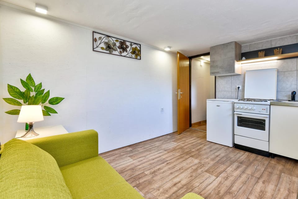 Family House, 2 Bedrooms, Balcony, Mountainside (Jungle House With Pool and Hot Tub) | Living area | 21-inch flat-screen TV with satellite channels, TV, fireplace