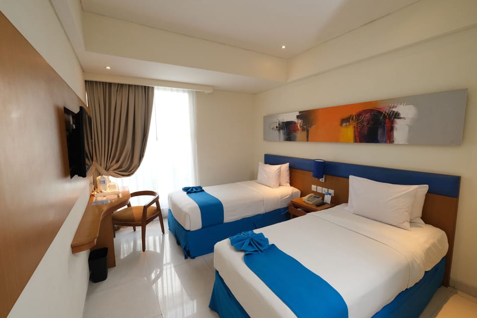 Premium bedding, down comforters, pillowtop beds, minibar