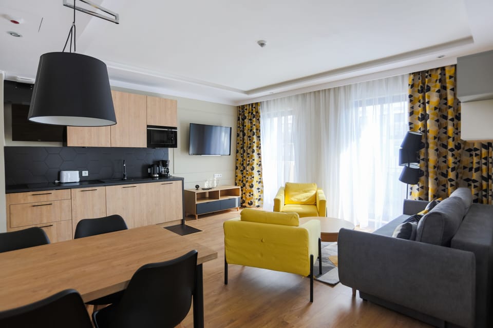 Family Apartment | Living area | 40-inch flat-screen TV with digital channels, TV