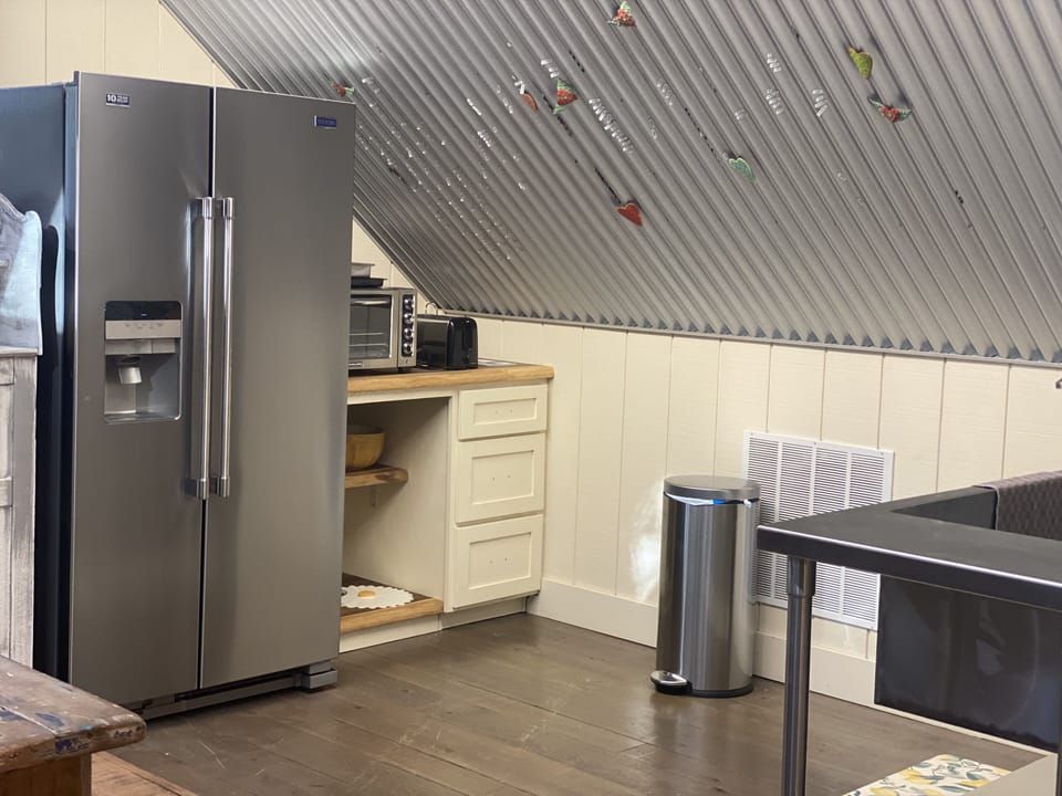 Our kitchen has a refrigerator, microwave, toaster, toaster oven but no stove. 
