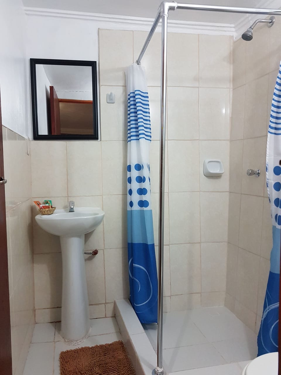 Shower, designer toiletries, towels