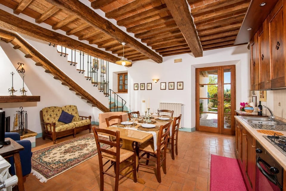 Open-plan living room with sofas, dining area, kitchen and WiFi internet